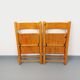 Pair of vintage folding chairs in pine from the 70s and 80s.
