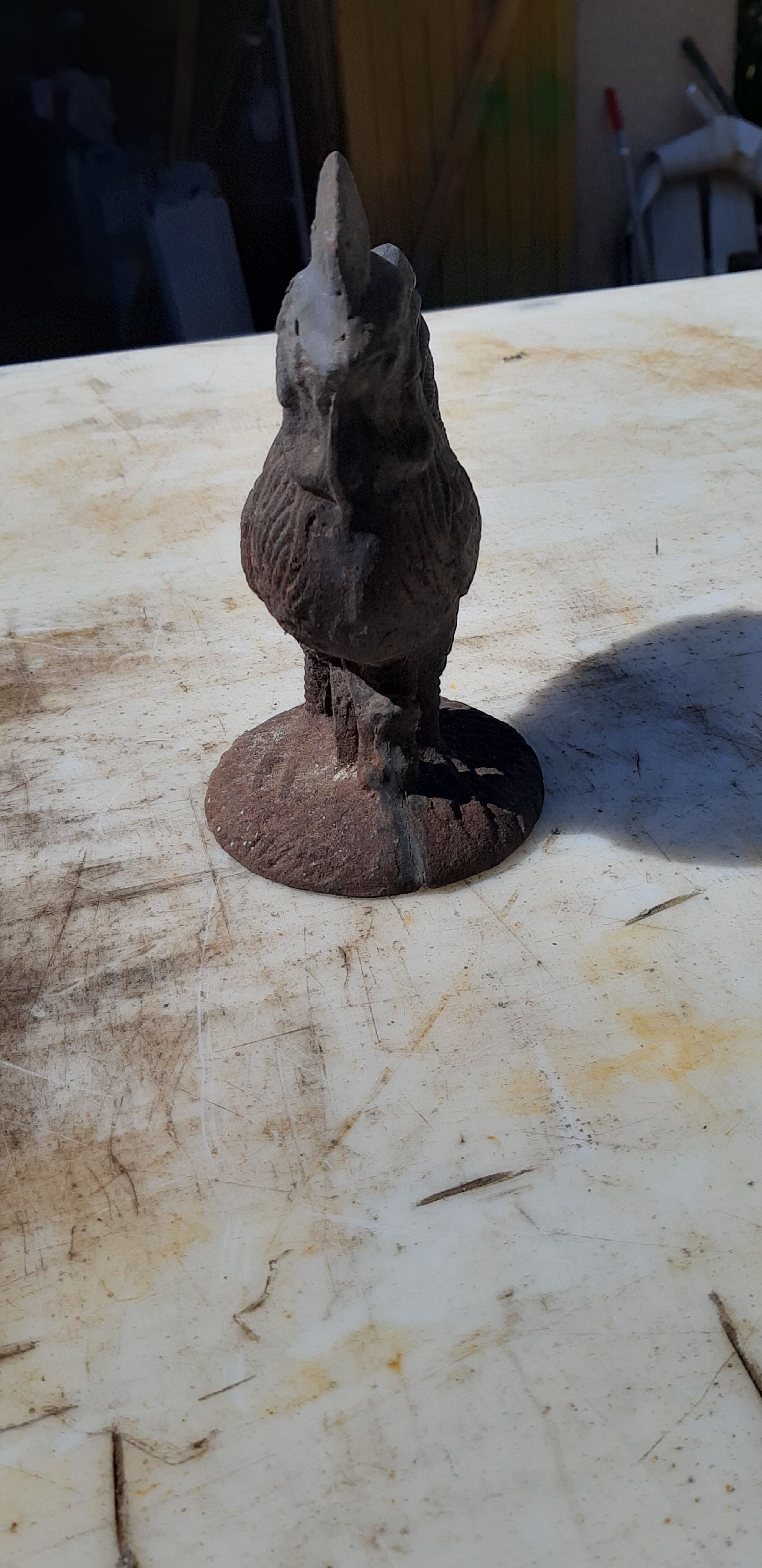 2 roosters and 2 cast iron birds