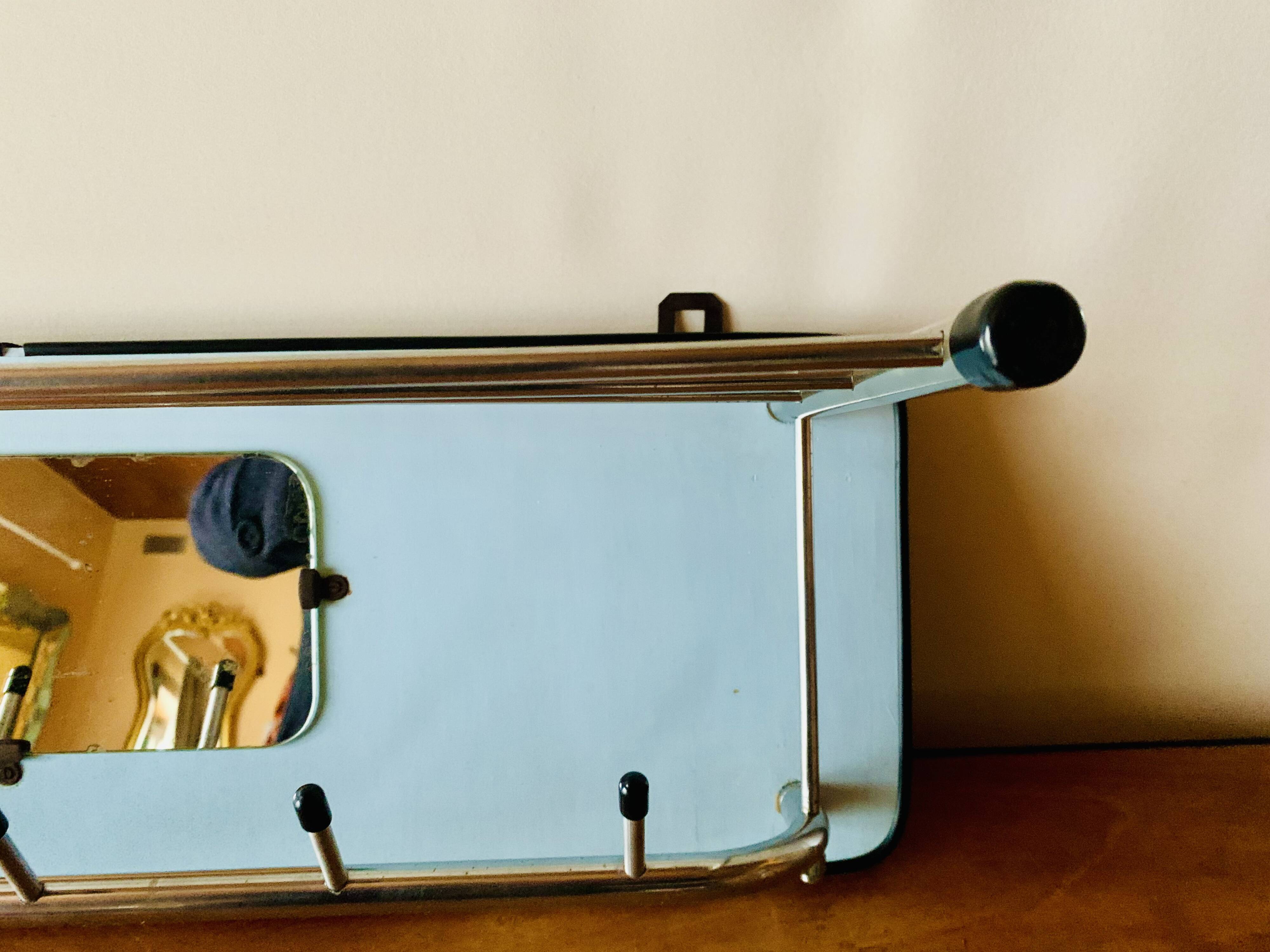 Vintage wall-mounted coat rack in wood and chrome metal with mirror