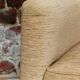 Fauteuil en velour beige et franges