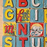 Antique wooden cube set, 40 pieces representing all the letters of the alphabet and ideograms linked to the letters