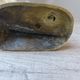 Golden brass cat figurine on fence looking at a mouse in a Vintage India shoe
