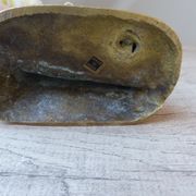 Golden brass cat figurine on fence looking at a mouse in a Vintage India shoe