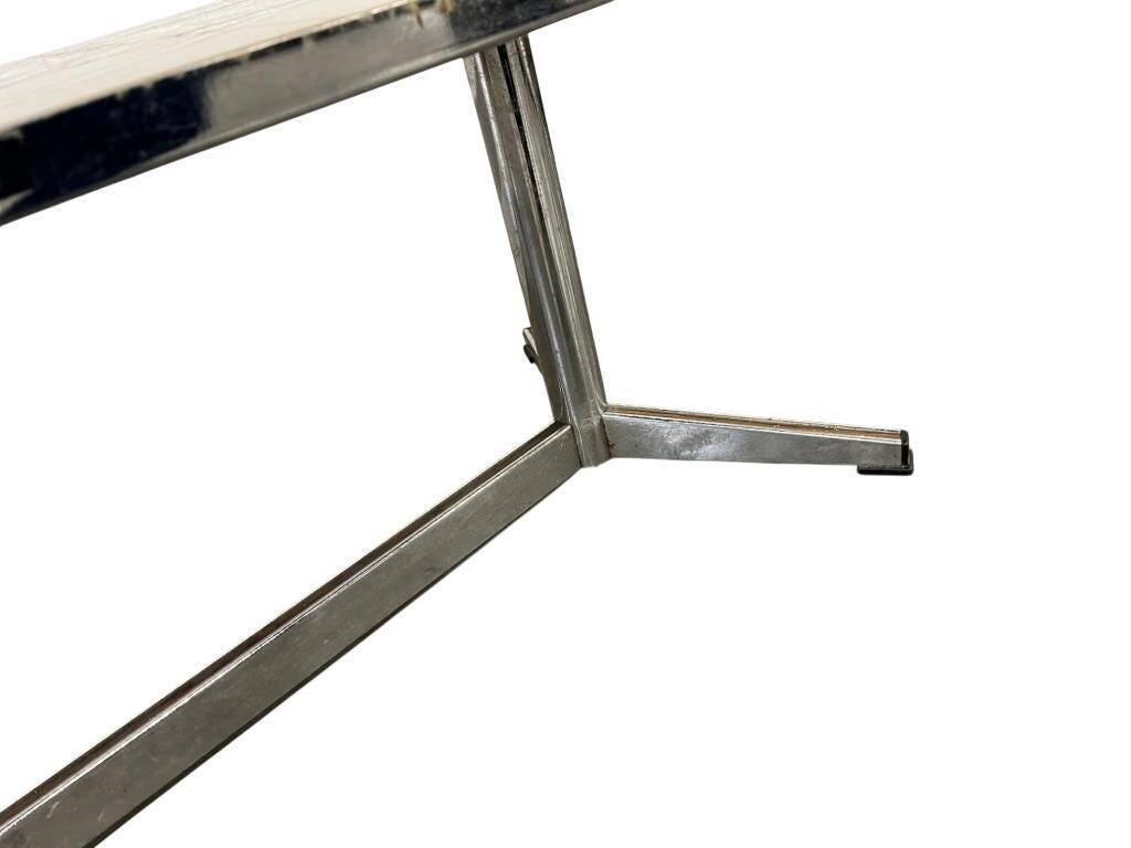 Vintage ceramic coffee table with a chrome frame.