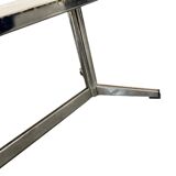 Vintage ceramic coffee table with a chrome frame.