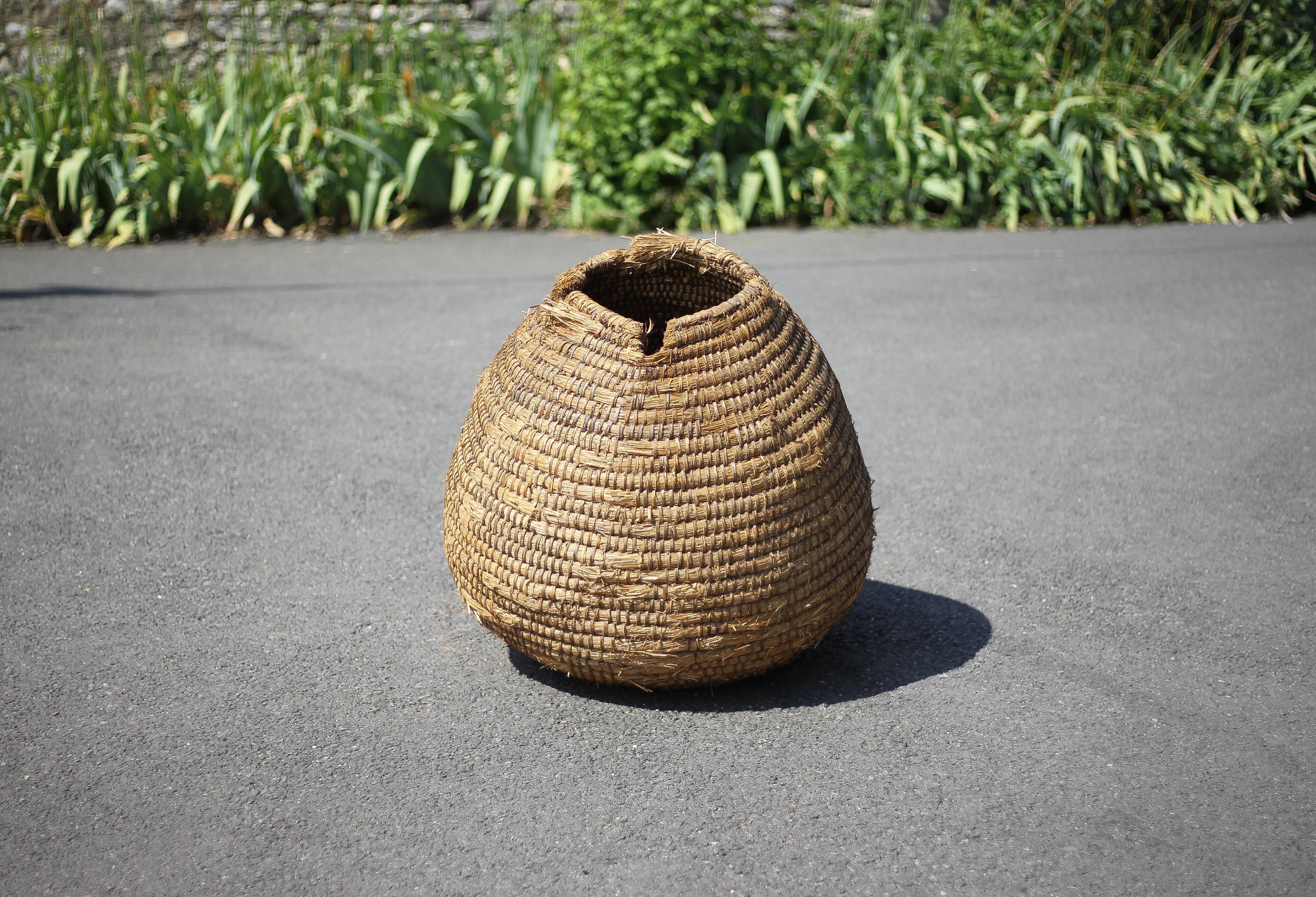 Old basket, burgundy straw and bramble, woven basket, interior decoration