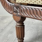 Louis XVI style meridian in carved wood and caning, 19th century.