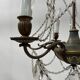 Louis XVI style chandelier with a pearl garland and painted tin, 20th century.