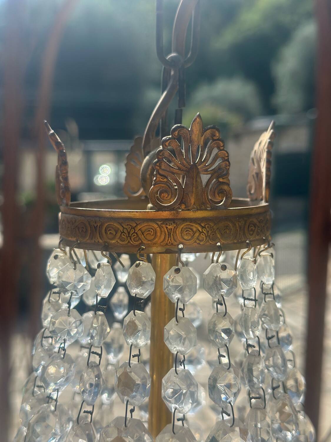 Basket chandelier with crystal and gilded brass pendants, circa 1930.
