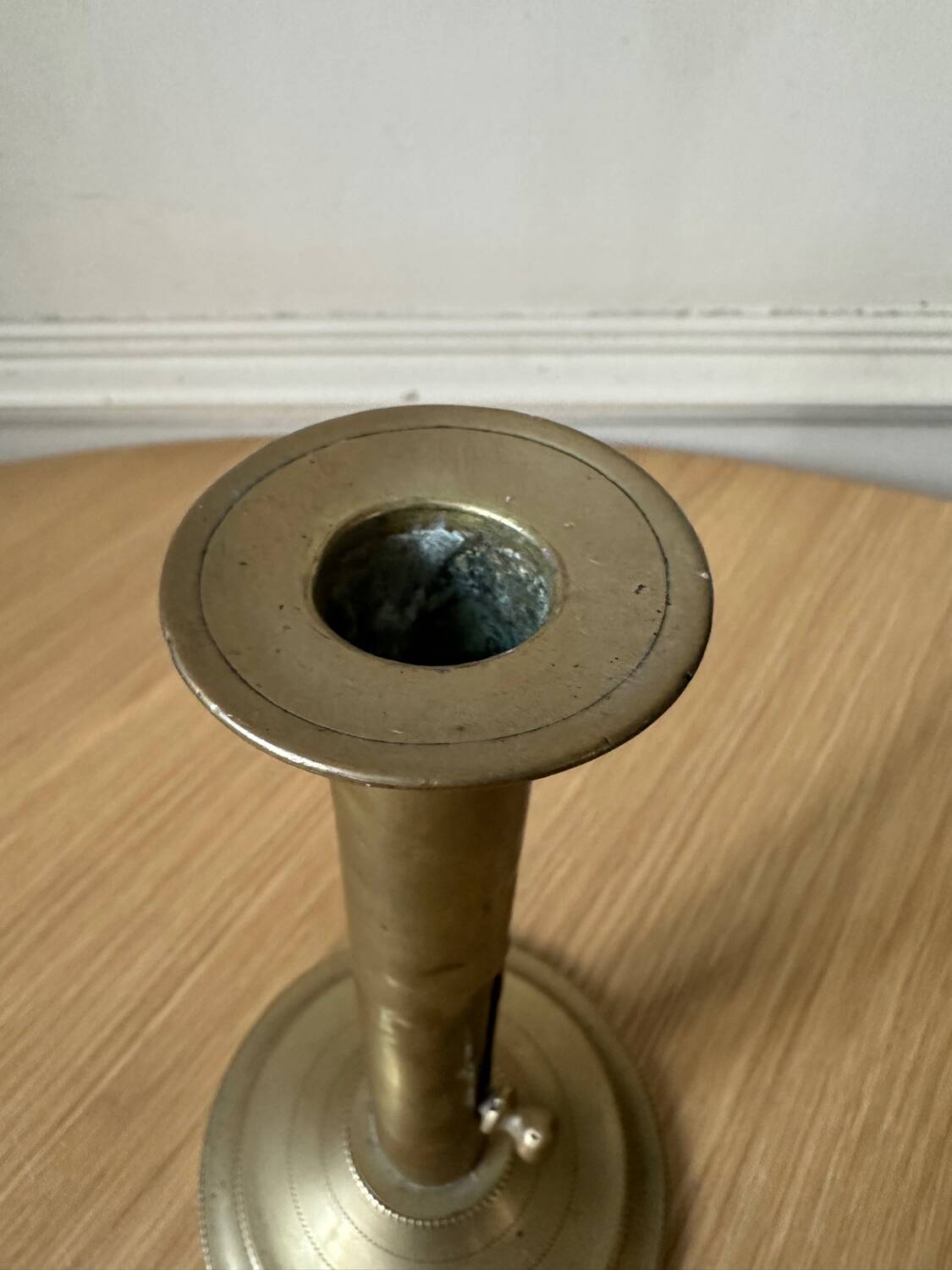 Old brass pull candle holder