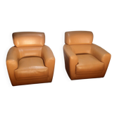 Pair of leather club armchairs: Roche and Bobois.