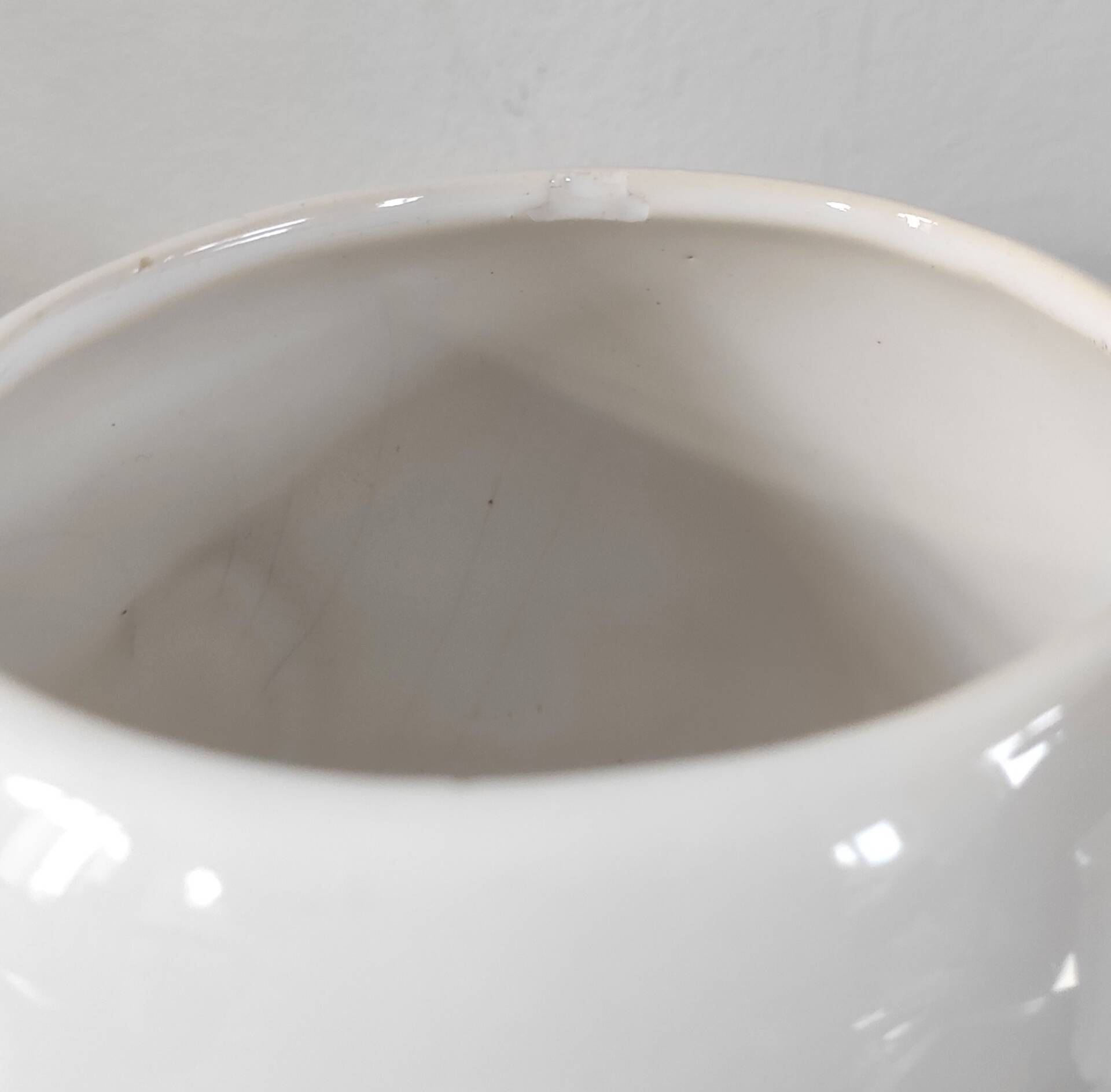 A pair of vintage ceramic plant pots.