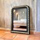 Louis-Philippe black and gold antique mirror from the 19th century
