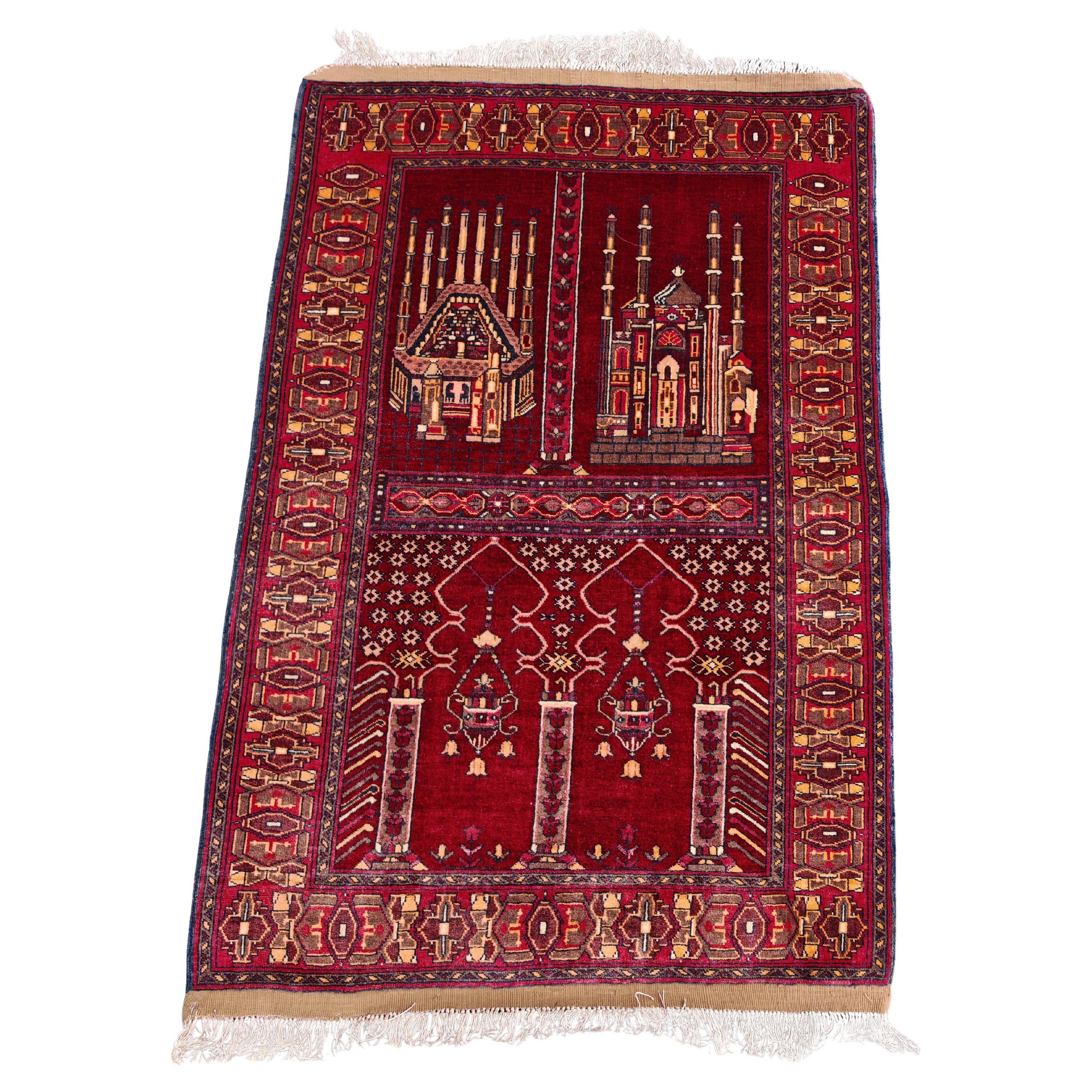 Vintage Afghan hand-knotted prayer rug with Islamic patterns.