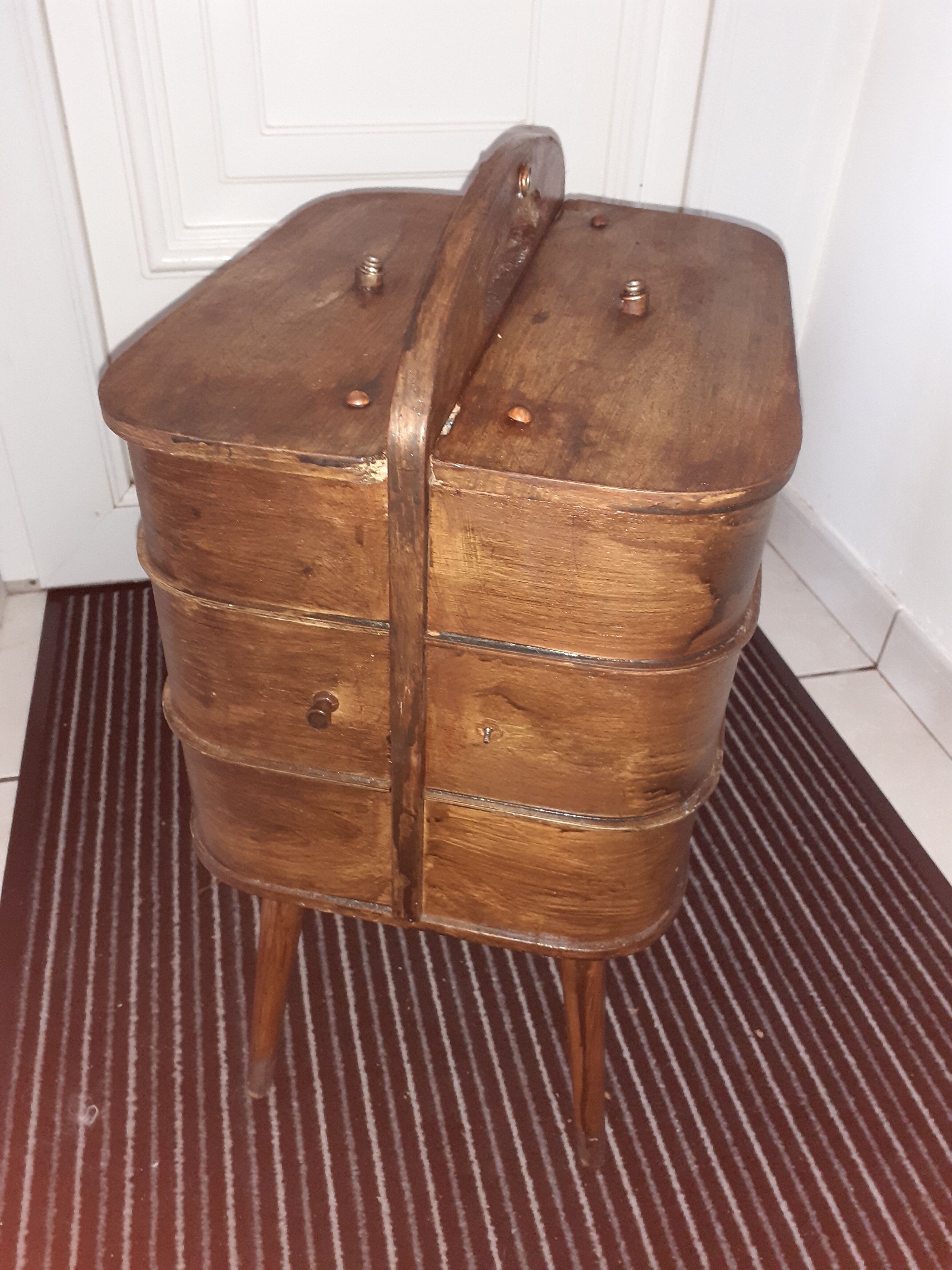 Wooden storage furniture with drawers. With a cove.