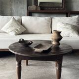 Coffee table, round antique Indonesian teak table with straight legs.