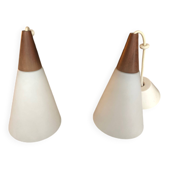Two Louis Kalff opaline and teak pendant lights