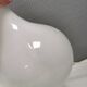 Helios table lamp, teardrop shaped, made of white opal glass. 1986 Denmark