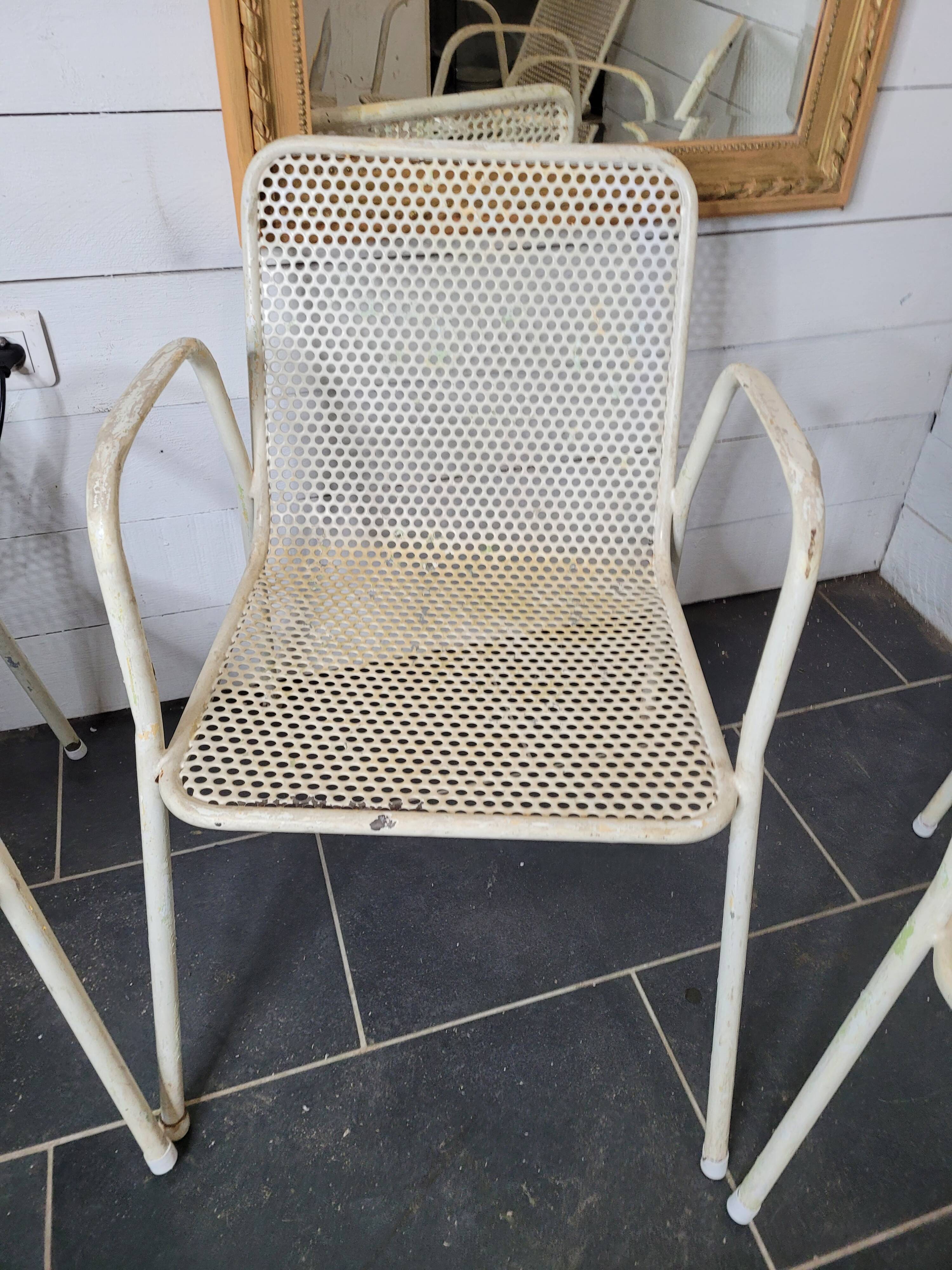 4 perforated metal garden armchairs