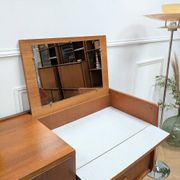 Dresser with integrated vanity.