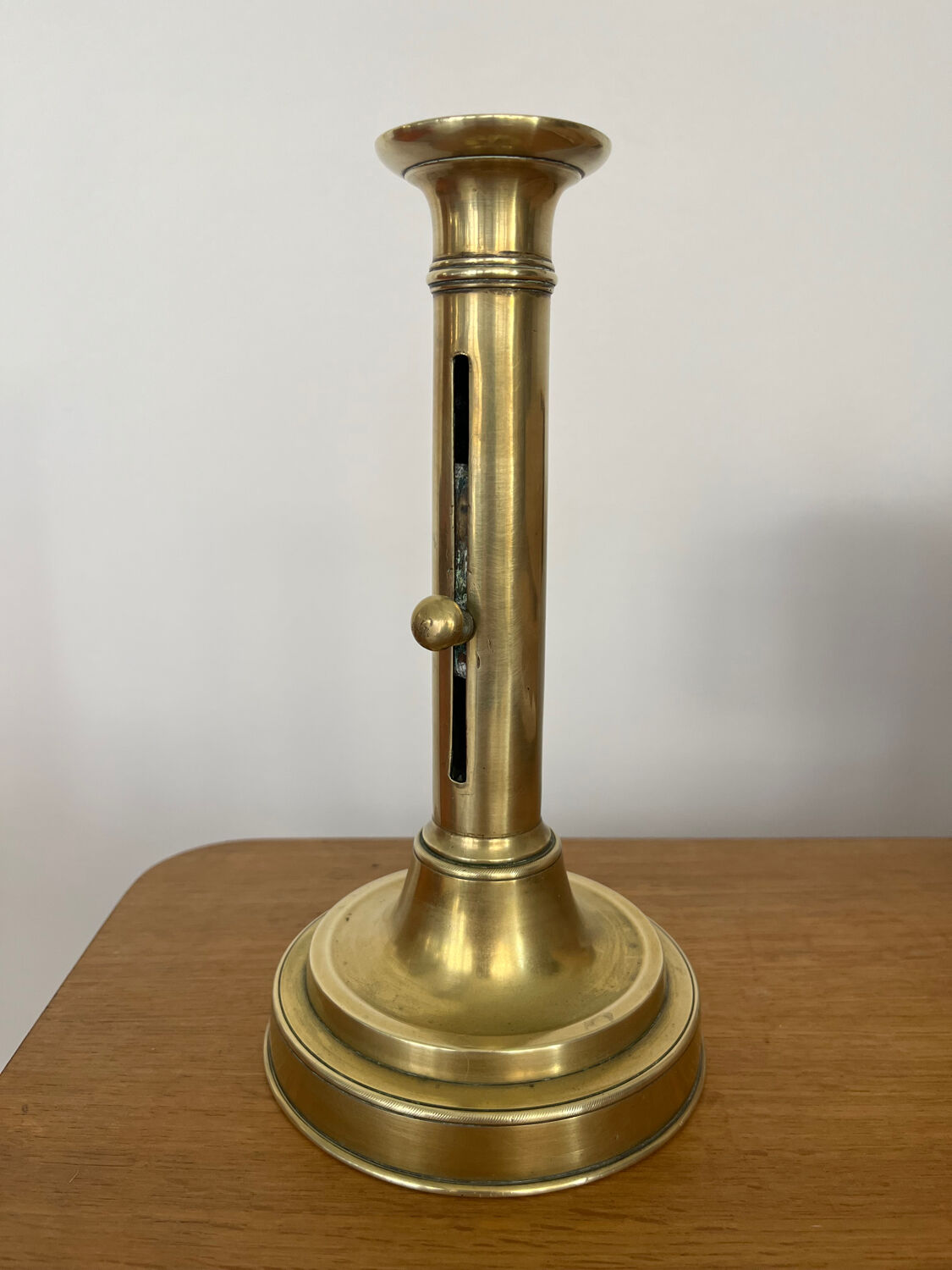 Antique brass push candle holder