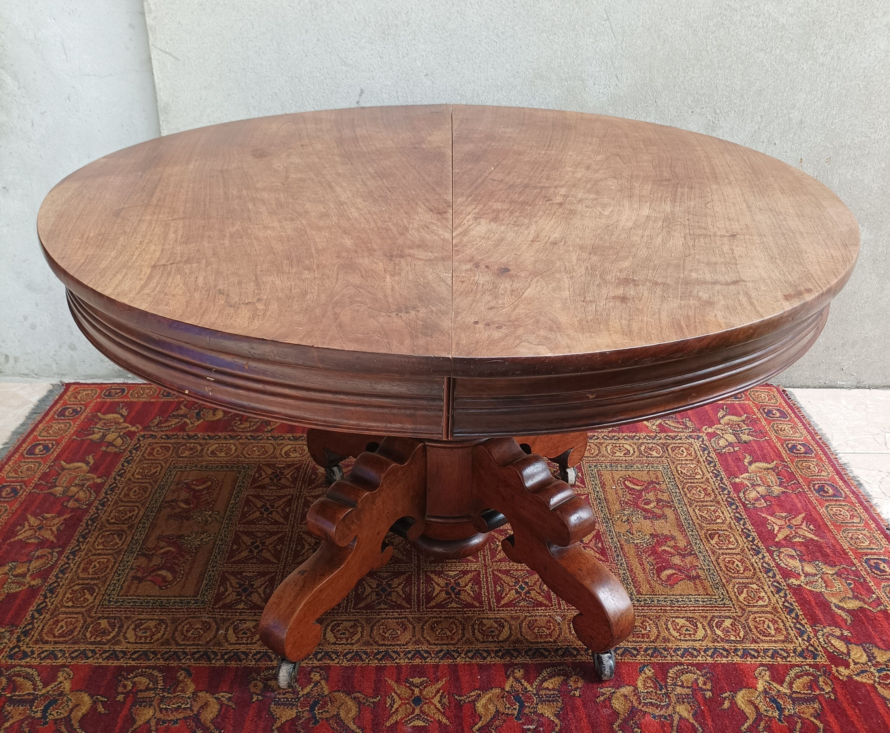 English oval table with 19th century mahogany extensions