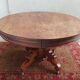 English oval table with 19th century mahogany extensions