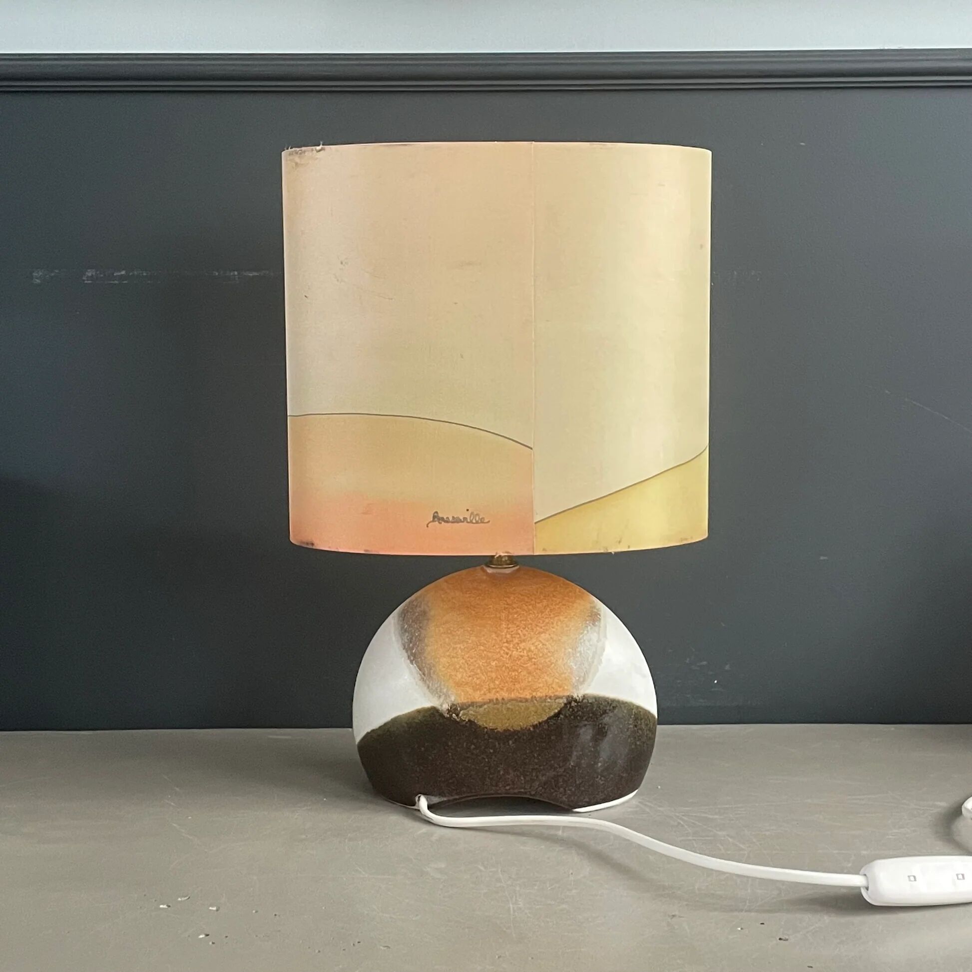 Ceramic floor lamp with a silk shade, signed.