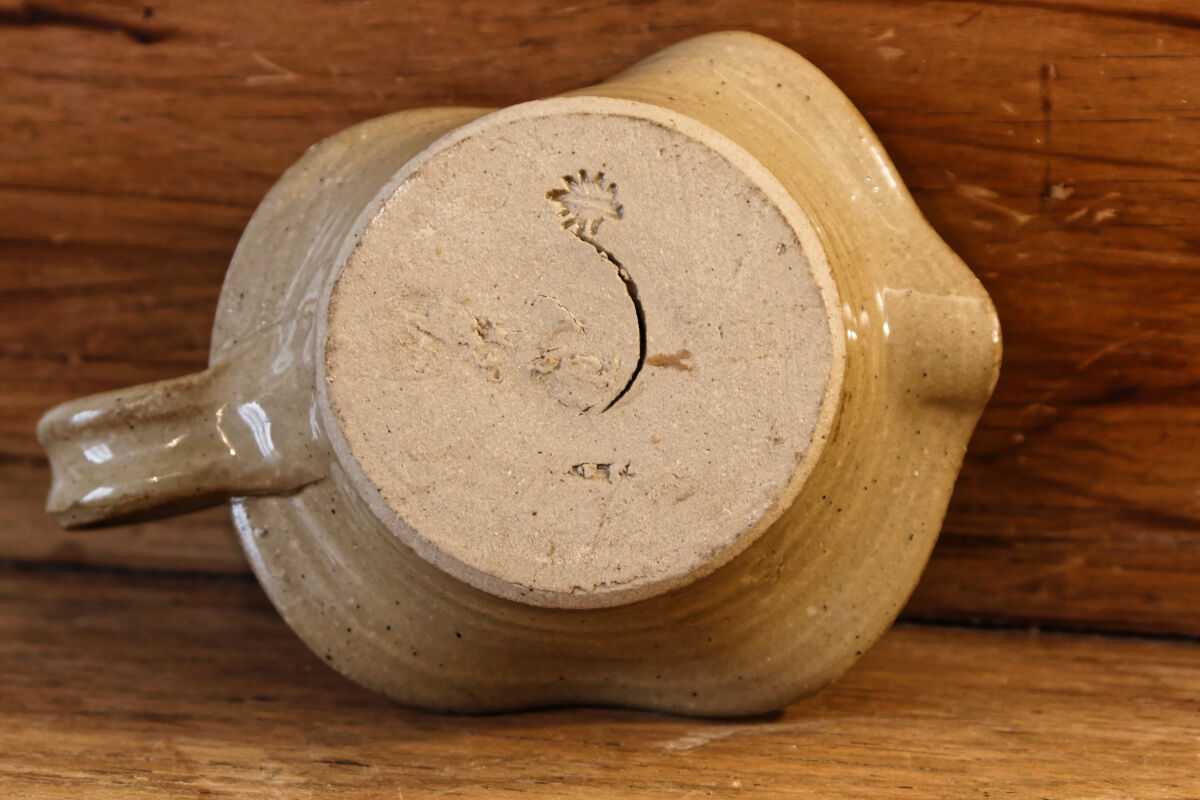 Signed sandstone candle holder