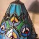 antique wrought iron floor lamp, 1900 to 1940 with stained glass lampshade