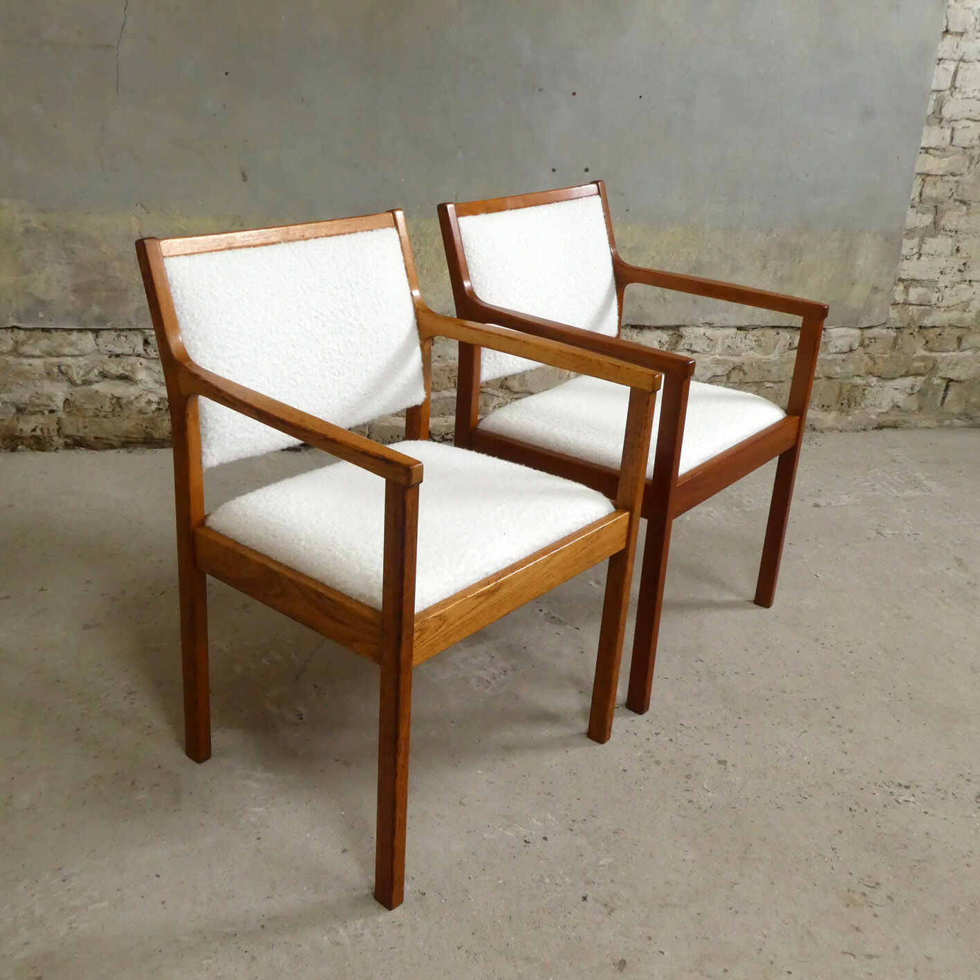 pair of Scandinavian teak armchairs and white buckles