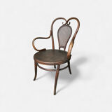 Antique curved wooden armchair with caning – Bistro style