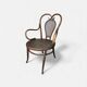 Antique curved wooden armchair with caning – Bistro style