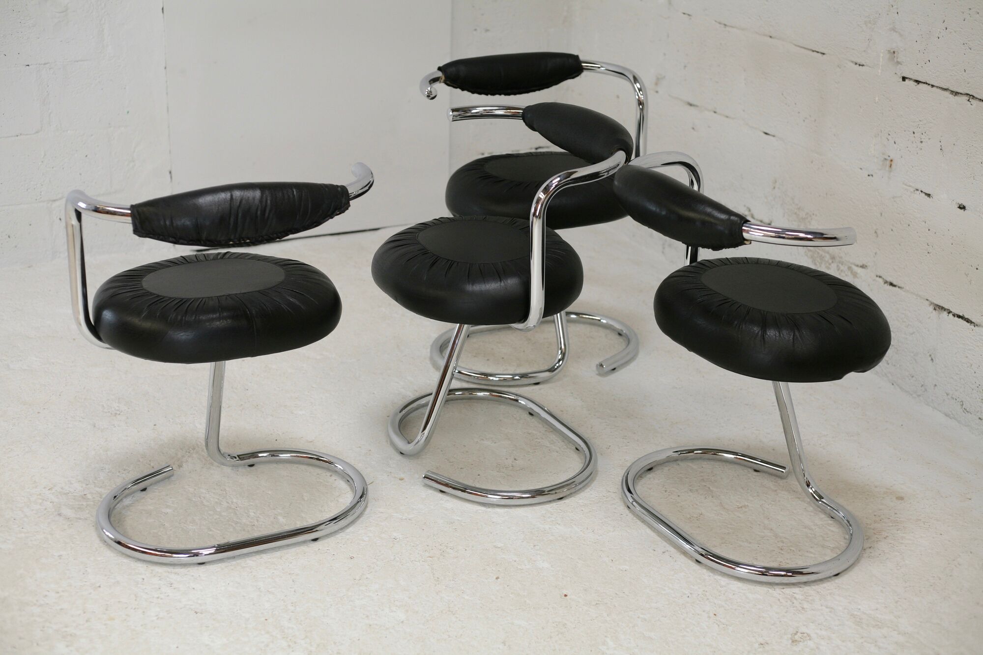 4 chairs tubular steel, imitation black leather, Italy, circa 1970