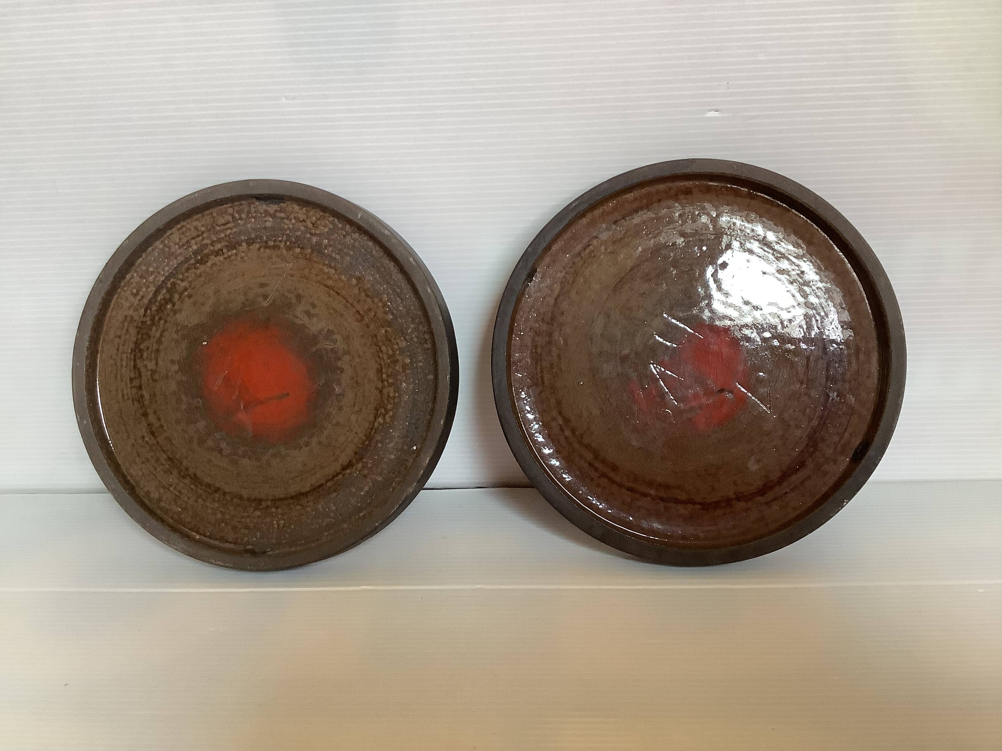 Pair of red speckled ceramic trivets