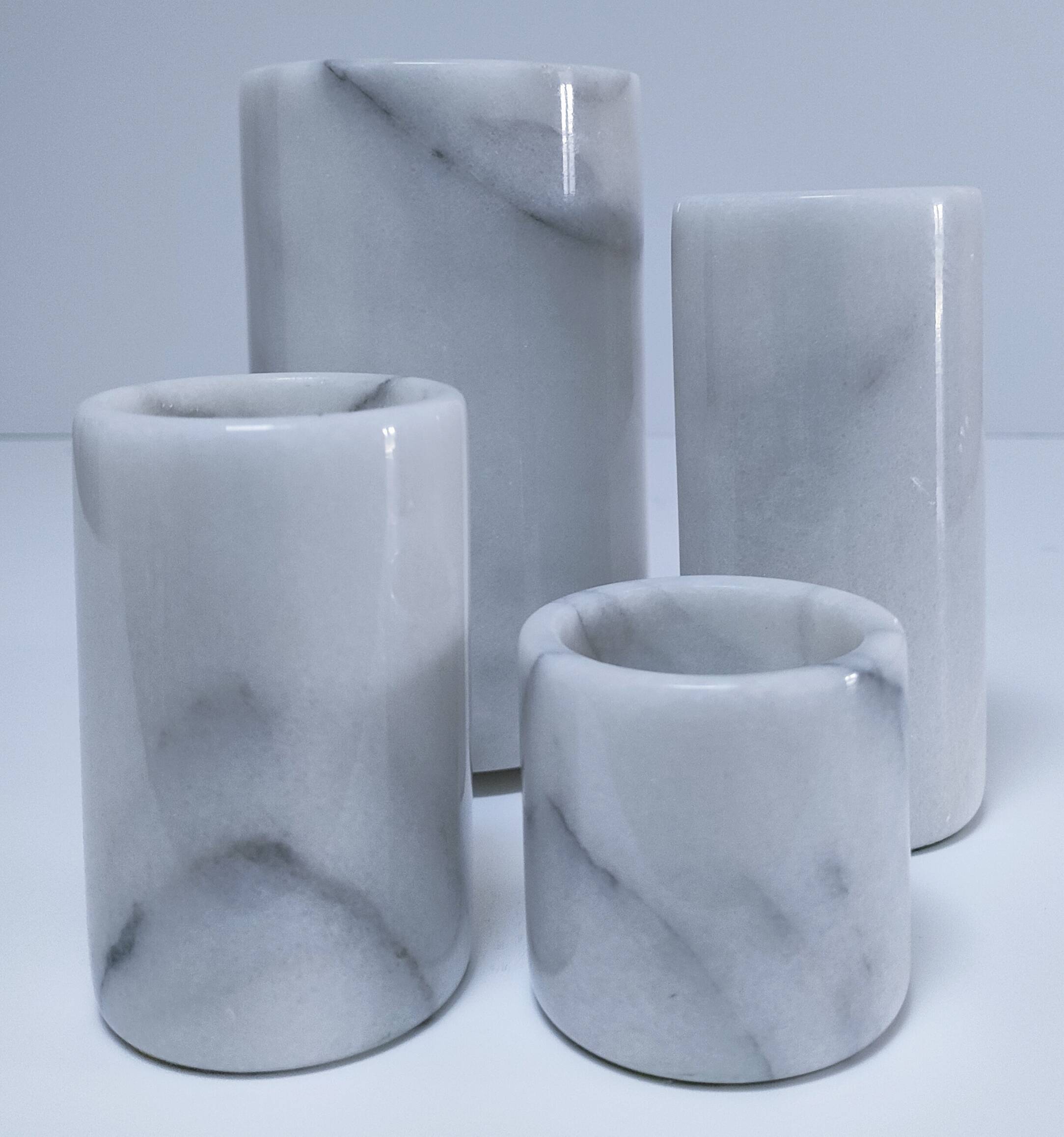 Four white marble candlesticks with black veins, 70s design