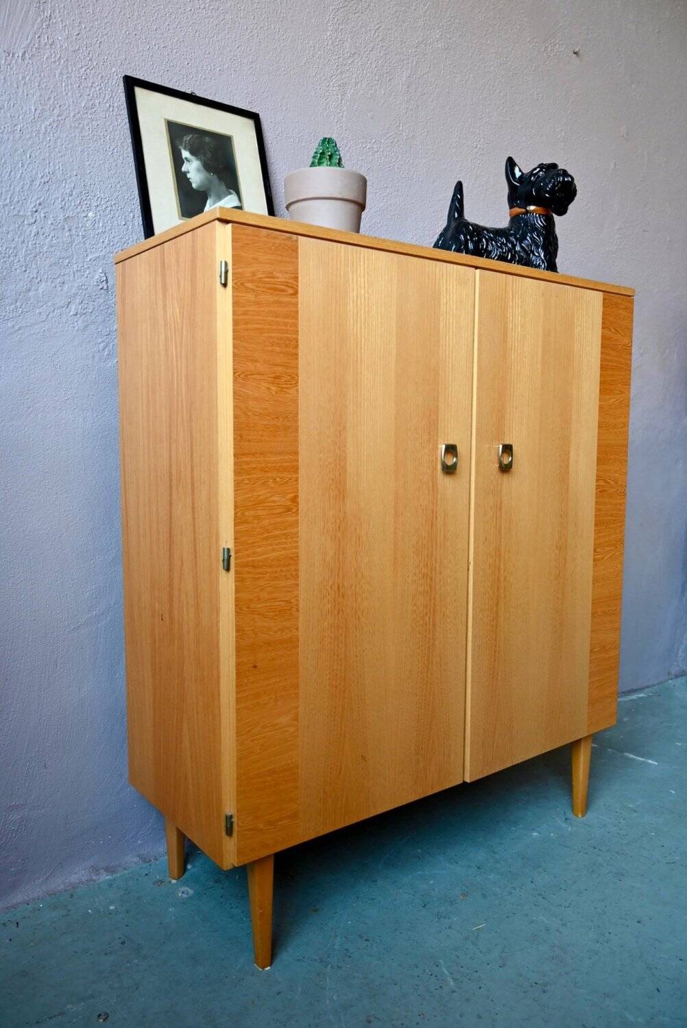 Vintage 1960s shoe cabinet in light wood and chrome metal.