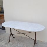 Restaurant bistro table in oval marble and decorated cast iron bases -1m51