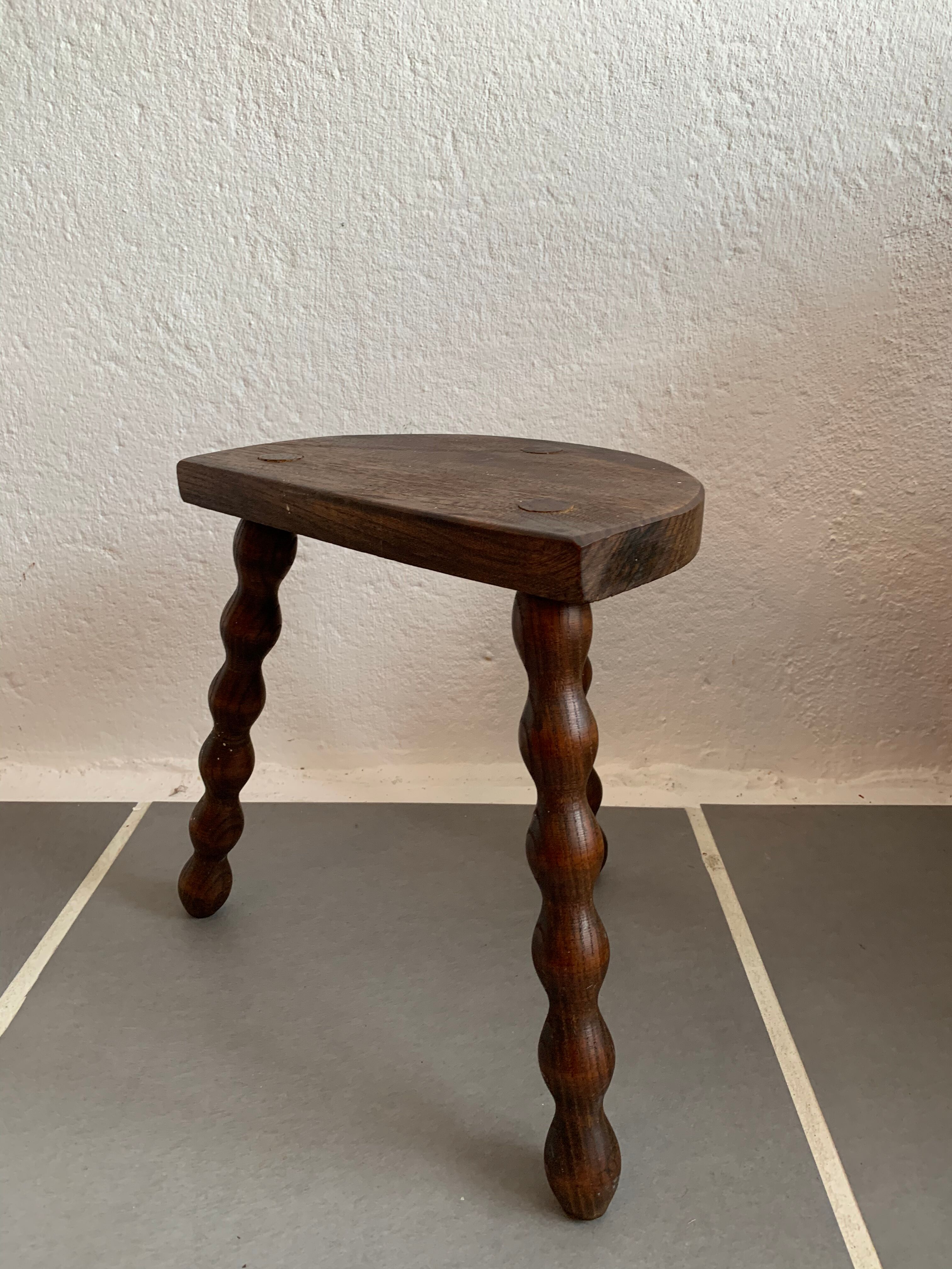 Old wood tripod farm stool