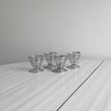 Set of 4 designer egg cups in shiny silver metal