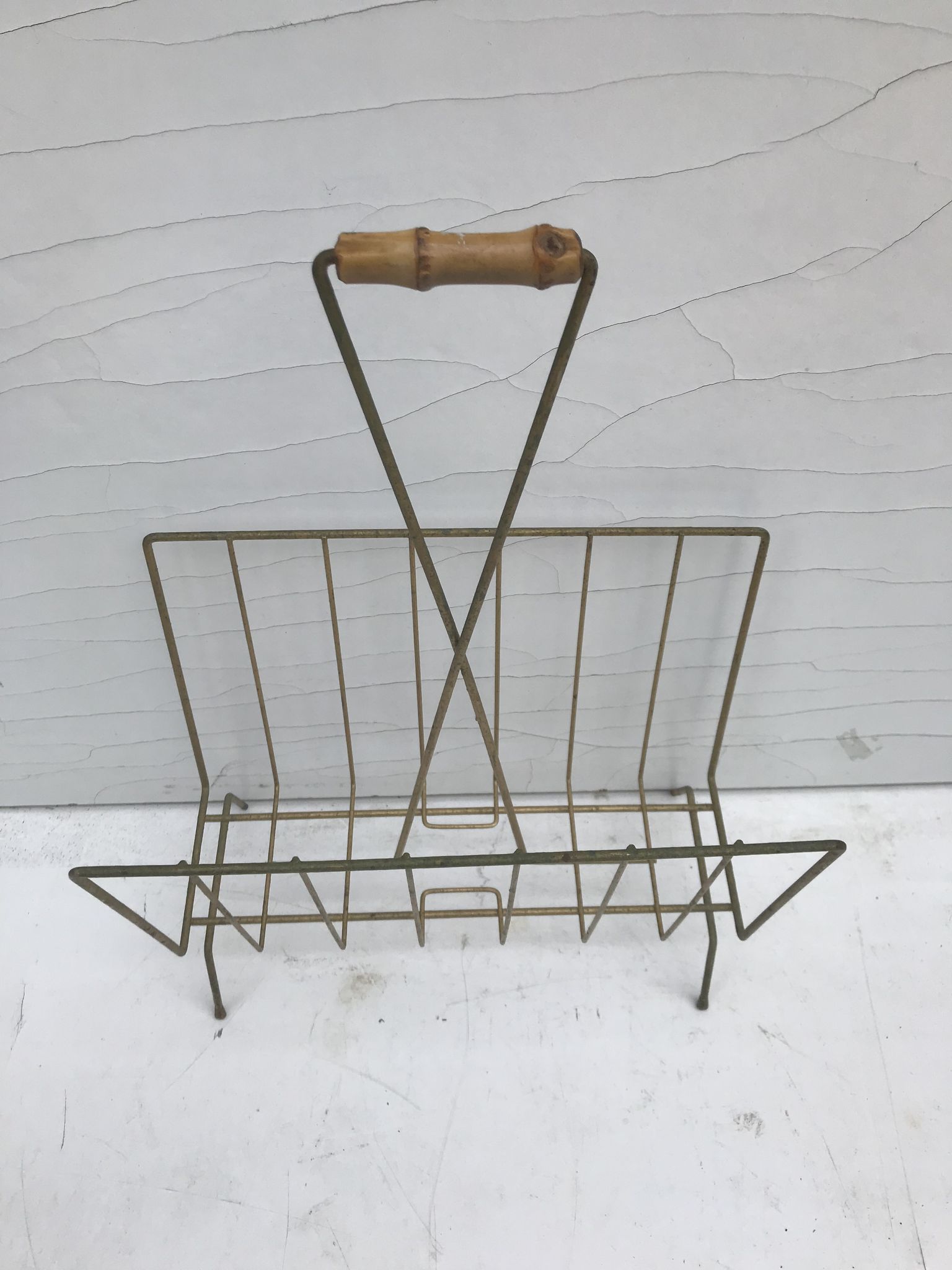 Magazine holder in golden metal and its handle is in bamboo, 1960 vintage