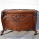 Old chest, carved wooden chest, curved chest on wheels, interior decoration
