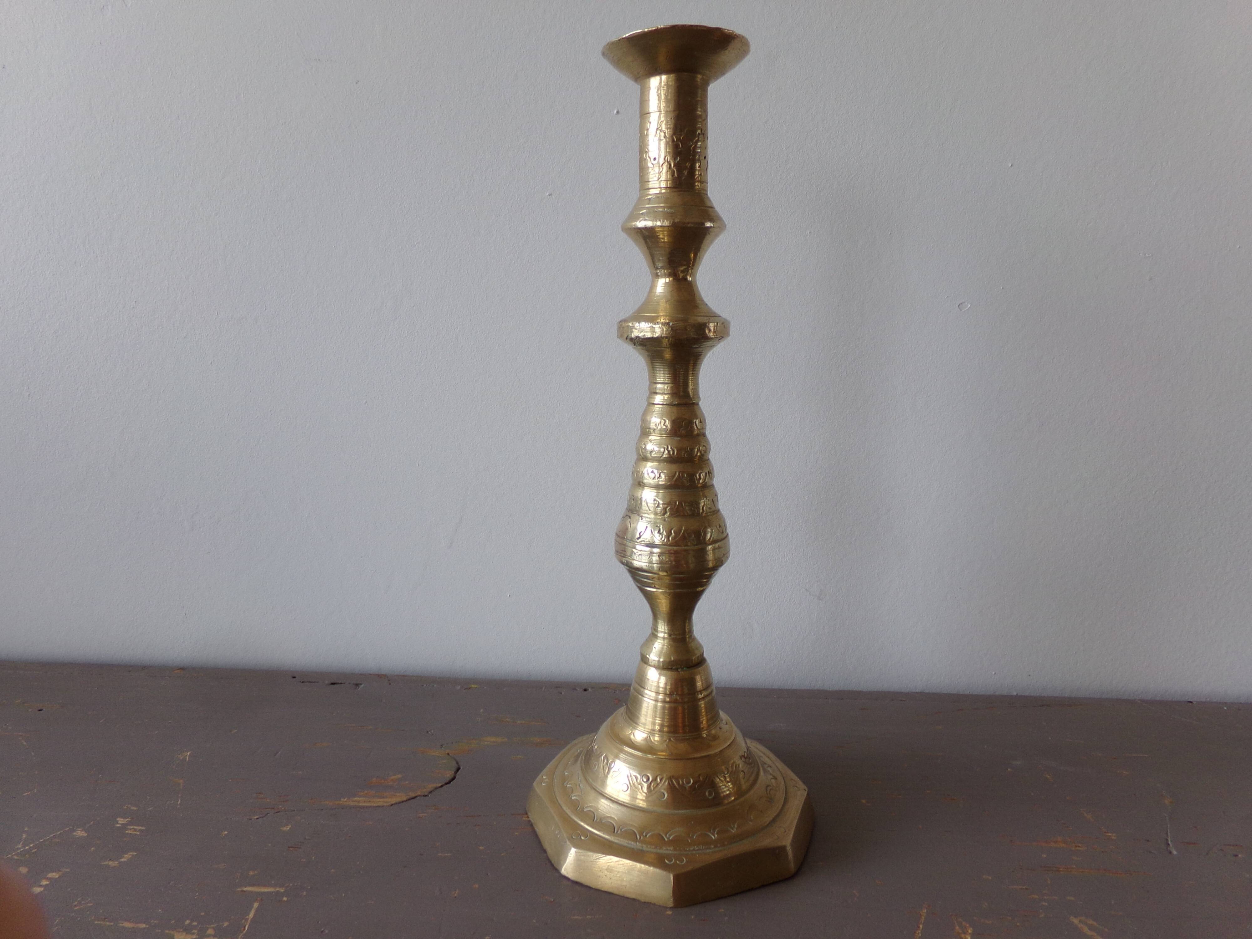 Old candle holder in gilded bronze