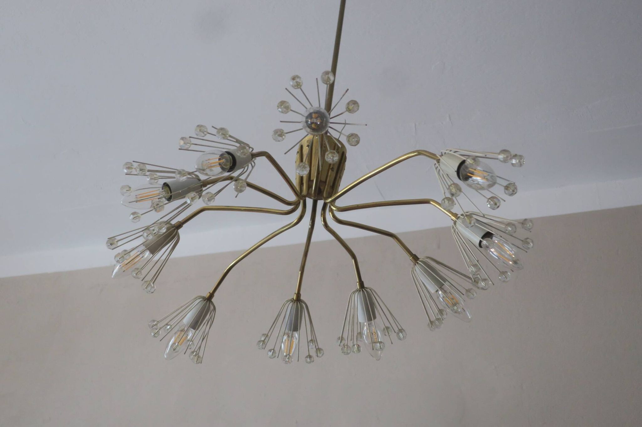 Elliptical brass and glass 10-arm chandelier, 1950s