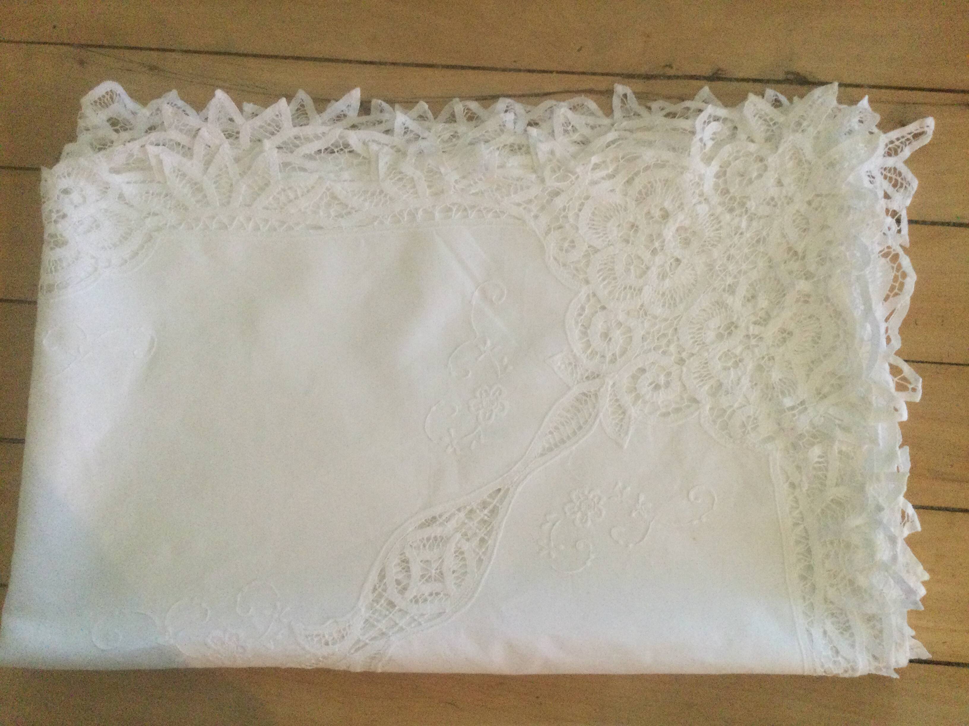Embroidered white tablecloth and lace