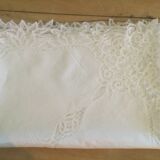 Embroidered white tablecloth and lace