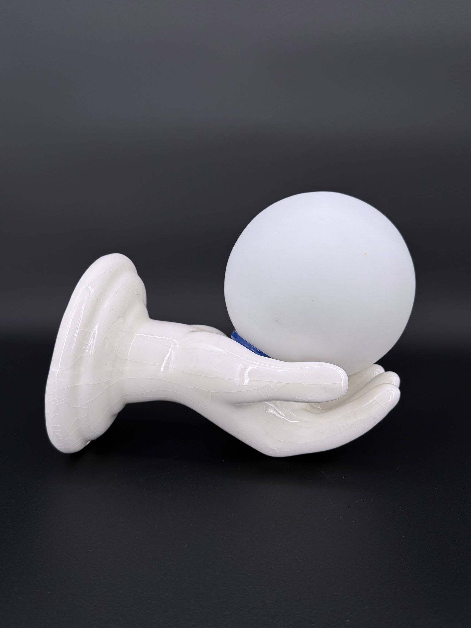 Vintage ceramic wall light - hand holding an opaline globe, 1970s