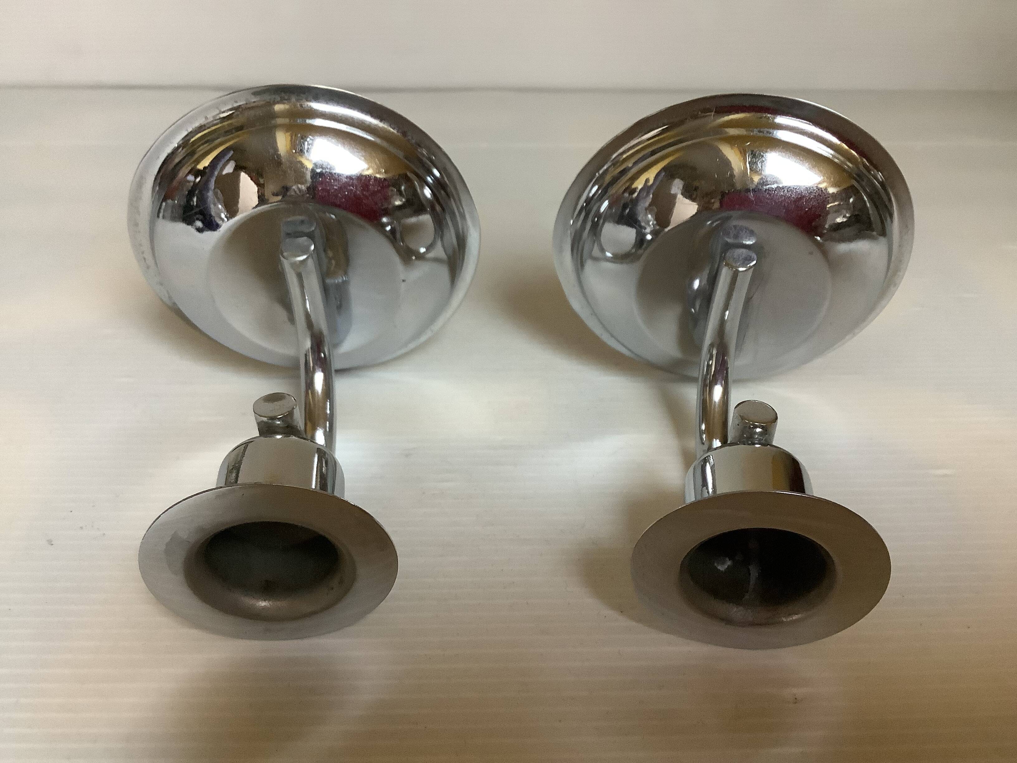 Pair of small silver metal candlesticks