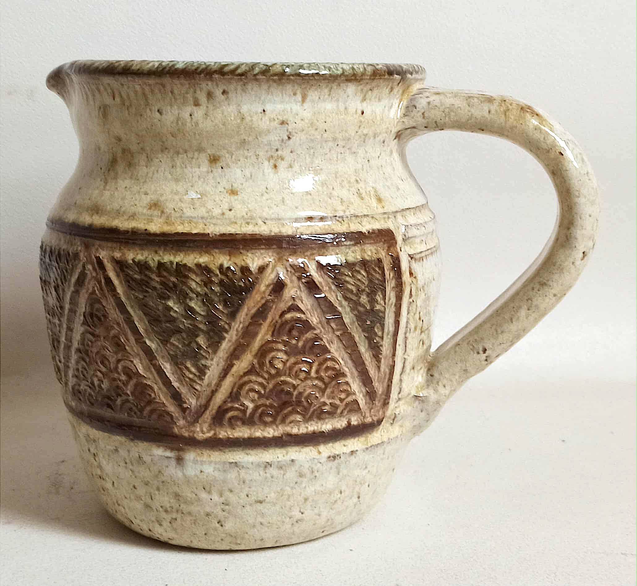 Stoneware pitcher stamped Giraud. Height 18.5 cm