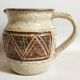 Stoneware pitcher stamped Giraud. Height 18.5 cm